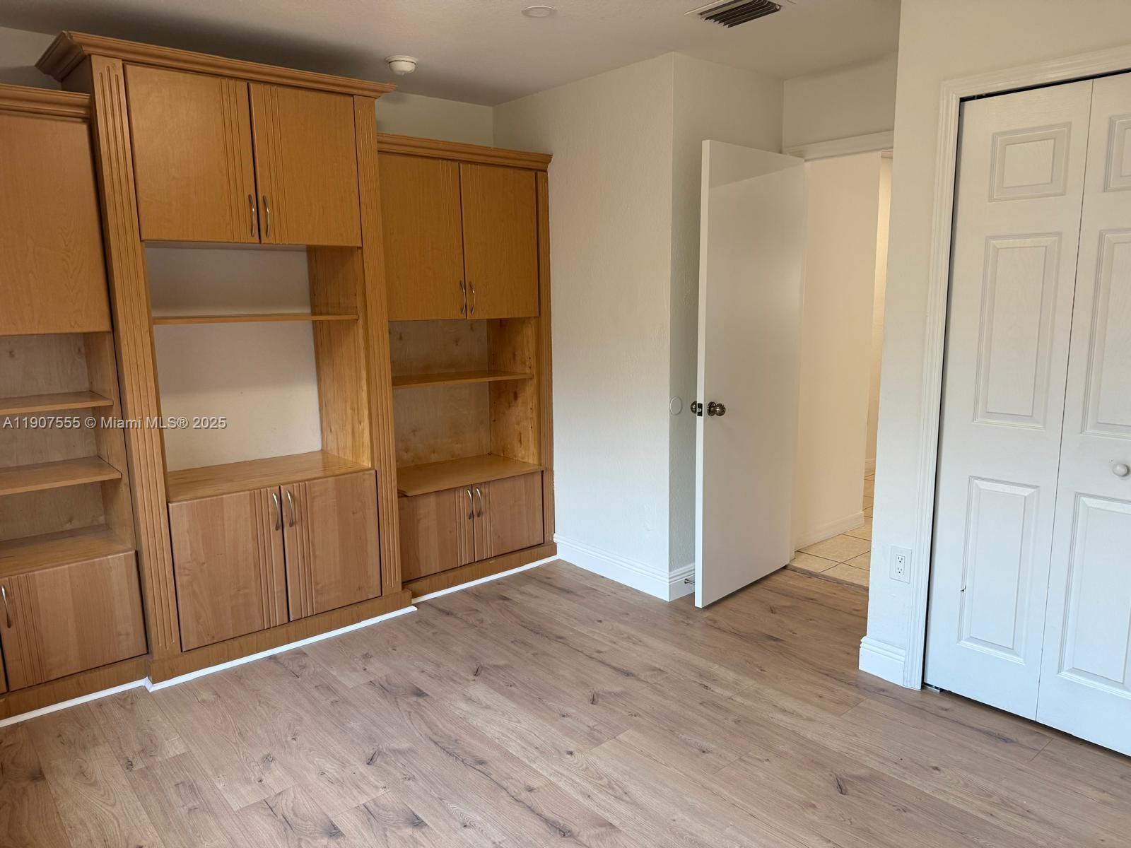 15530 Southwest 26th Terrace Miami, FL 33185 - Photo 20 of 26 an empty room with wooden floor