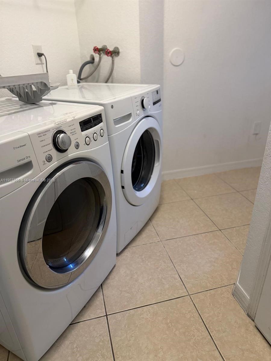 15530 Southwest 26th Terrace Miami, FL 33185 - Photo 22 of 26 a utility room with dryer and washer