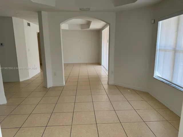 an empty room with a natural light