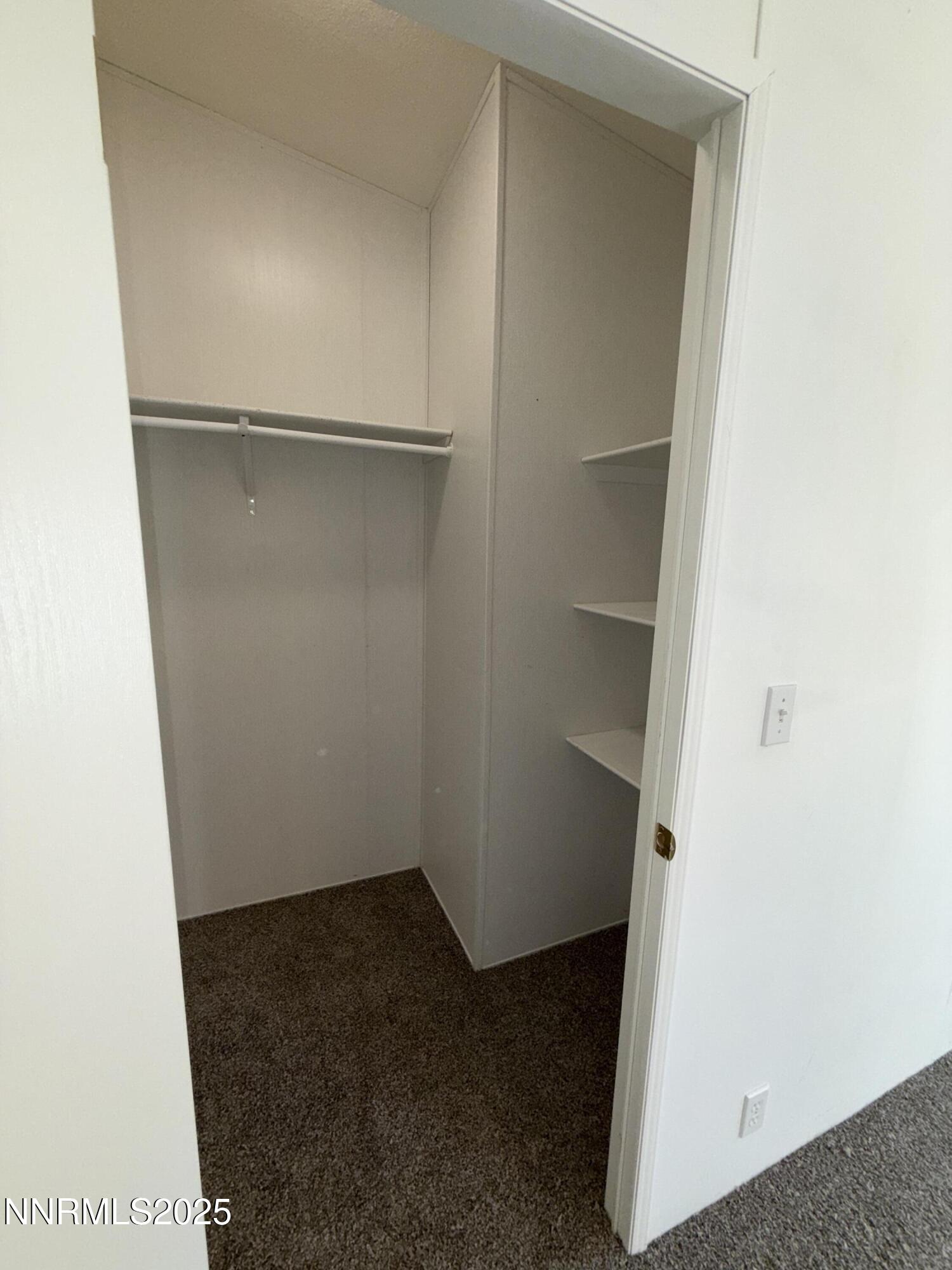 1166 Slate Road Topaz Ranch Estates, NV 89444 - Photo 14 of 31 a view of an empty walk in closet