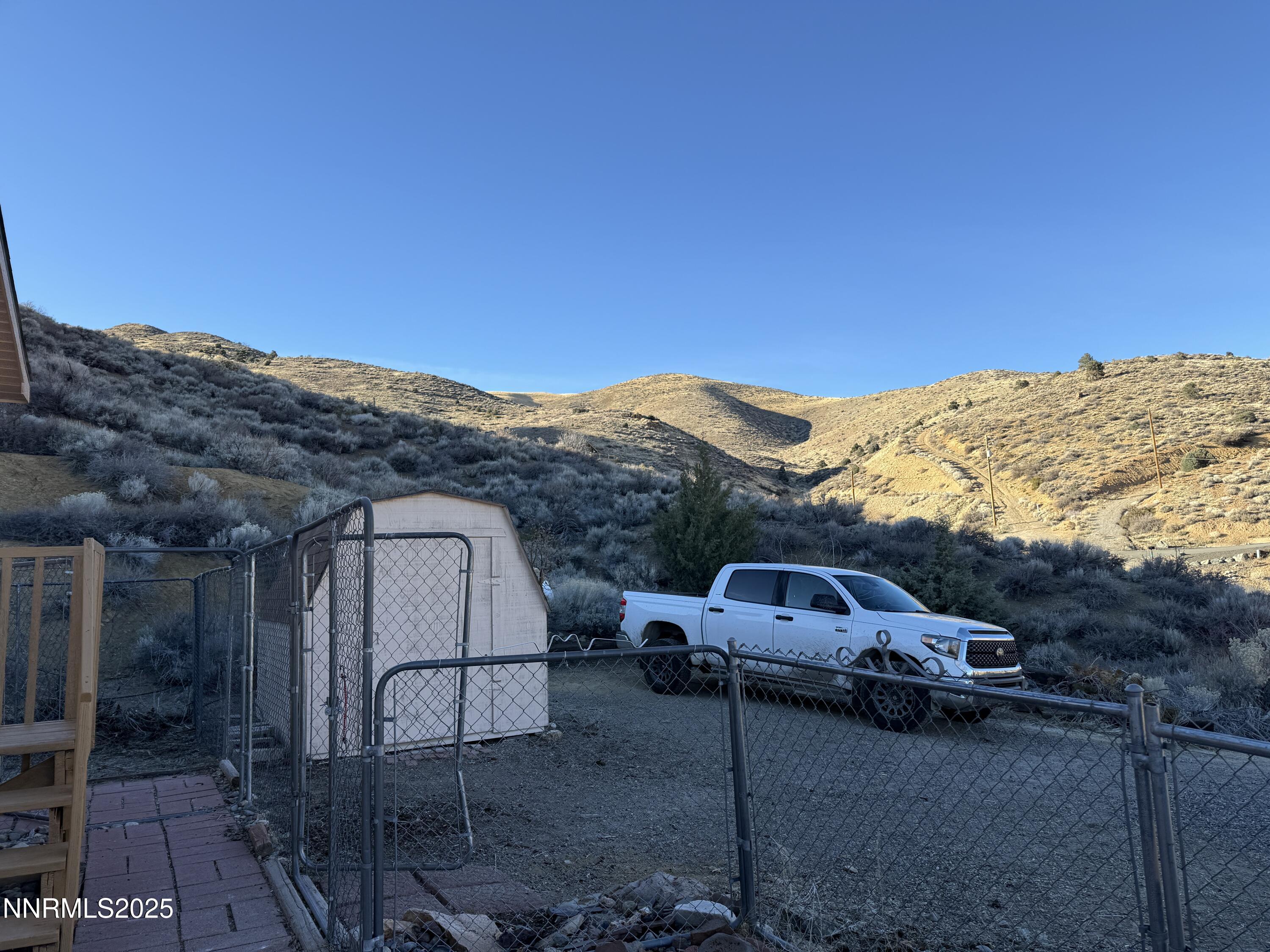 1166 Slate Road Topaz Ranch Estates, NV 89444 - Photo 26 of 31 a view of a car in front of a house