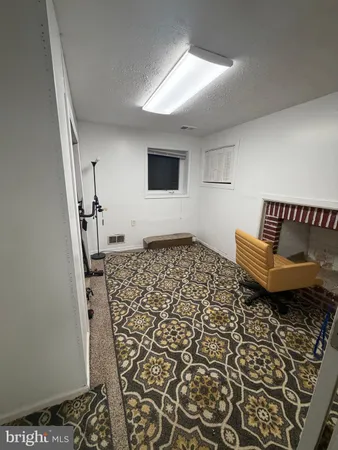 a living room with a couch and a rug
