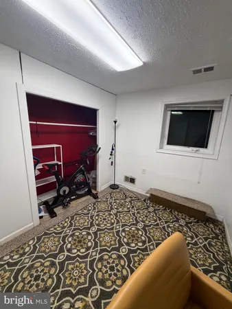 a living room with a couch and a flat screen tv