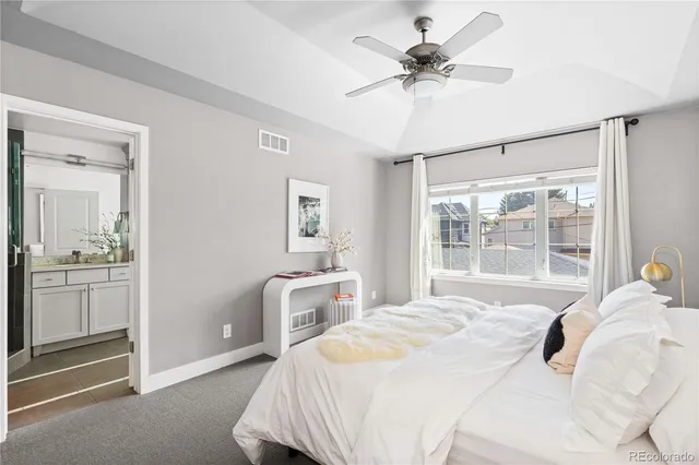 a bath tub sitting in a bathroom next to a sink
