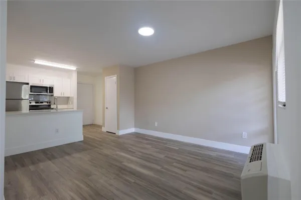 a view of kitchen with wooden floor