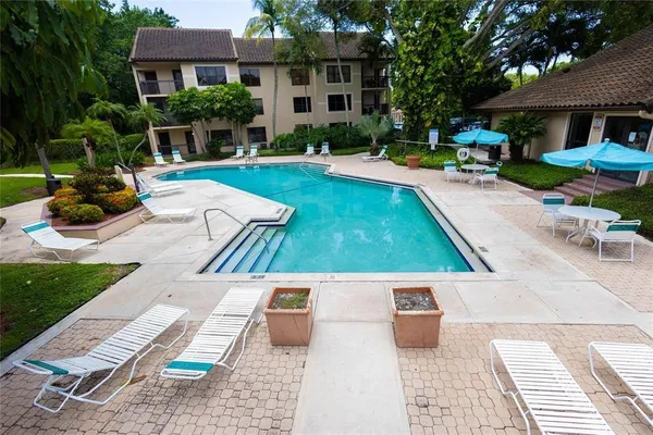 a view of a backyard with sitting area