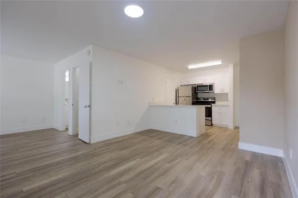 a view of kitchen with wooden floor