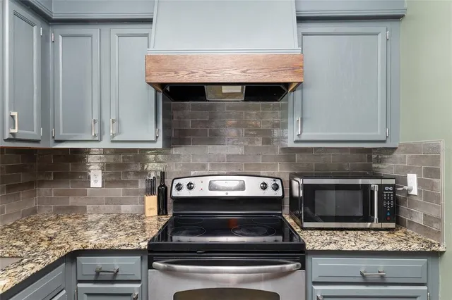 a view of hallway with furniture and a window