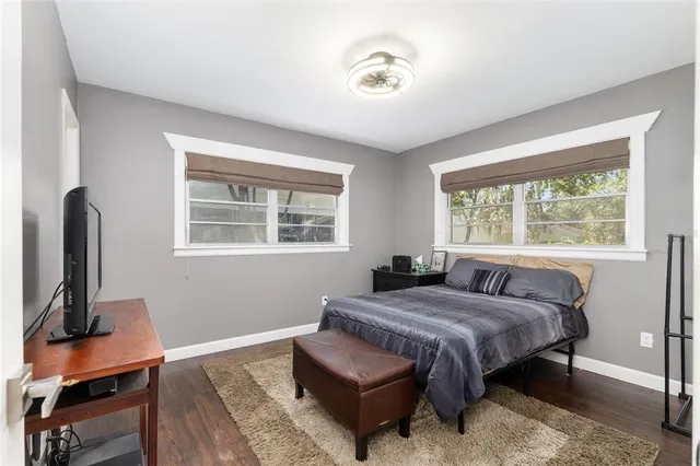 a bathroom with a shower and a window