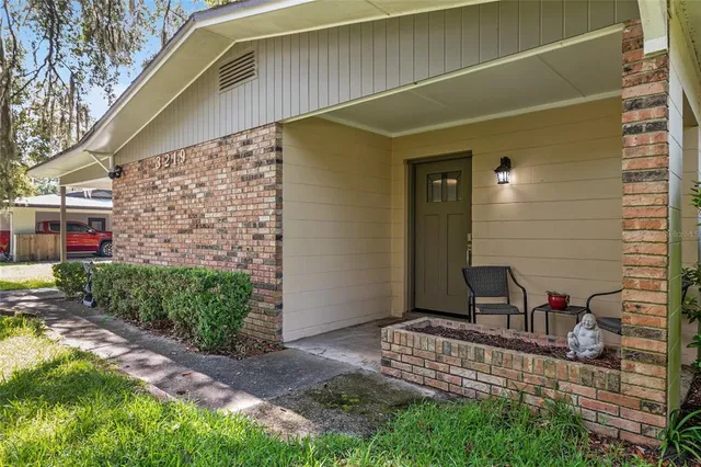 a view of two chairs in the patio