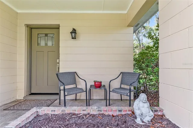 a living room with a rug and a table