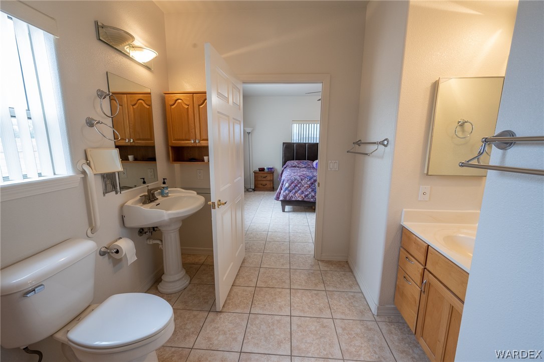5762 Ruth Drive Fort Mohave, AZ 86426 - Photo 18 of 29 a bathroom with a sink a toilet and shower
