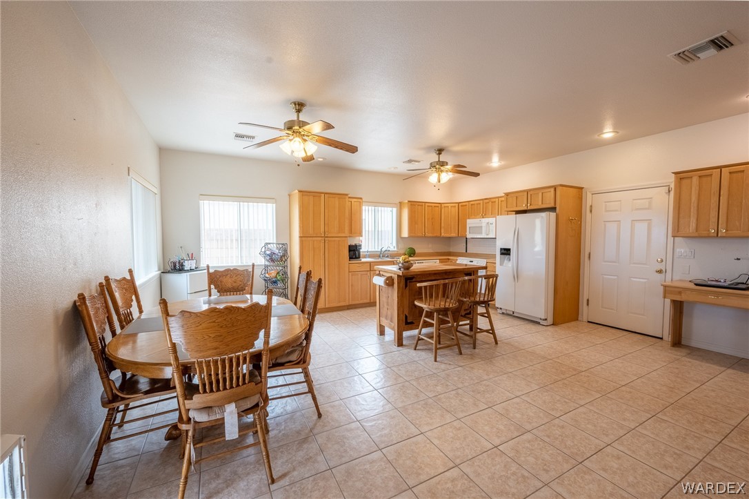 5762 Ruth Drive Fort Mohave, AZ 86426 - Photo 4 of 29 a view of a dining room with furniture and a kitchen