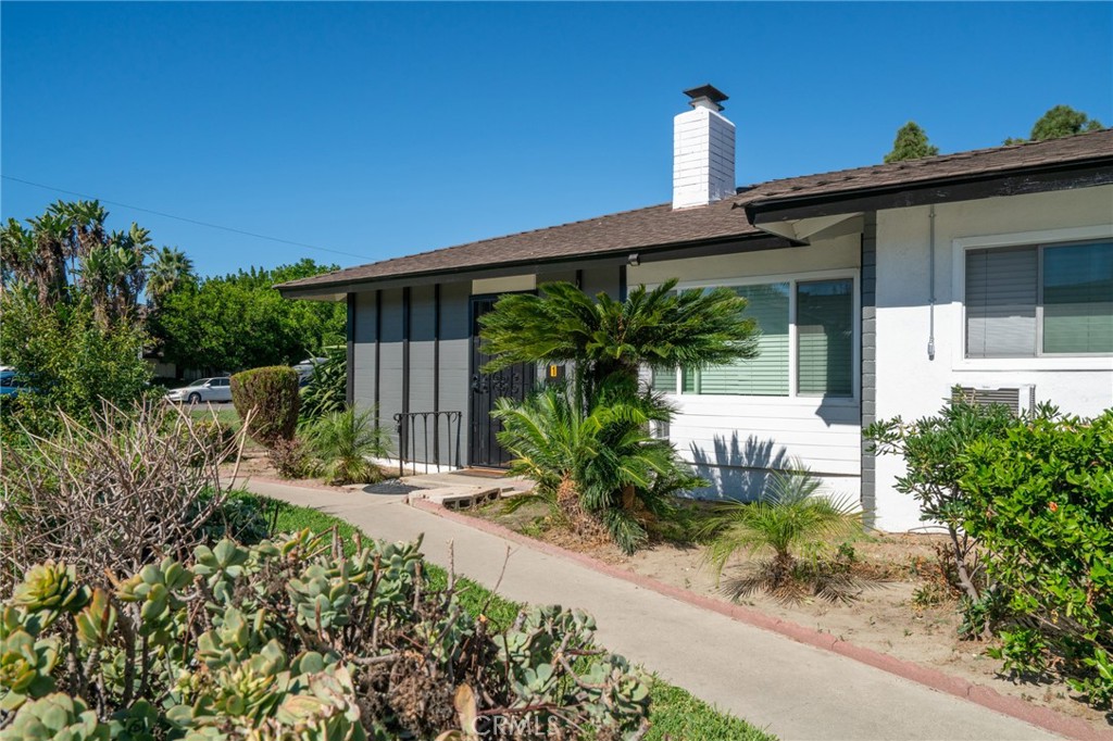 13262 Verde Street Garden Grove, CA 92844 - Photo 4 of 10 a front view of a house with garden