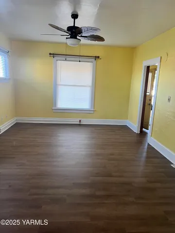 a view of a kitchen island wooden floor and a window