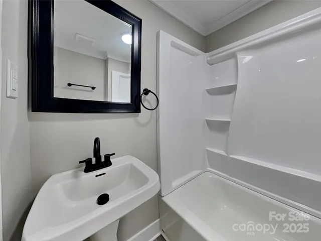 a bathroom with a sink and mirror