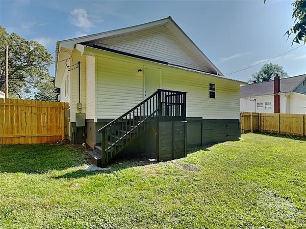 a view of a backyard of the house