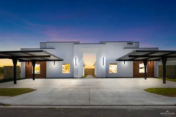 a view of a building with a yard