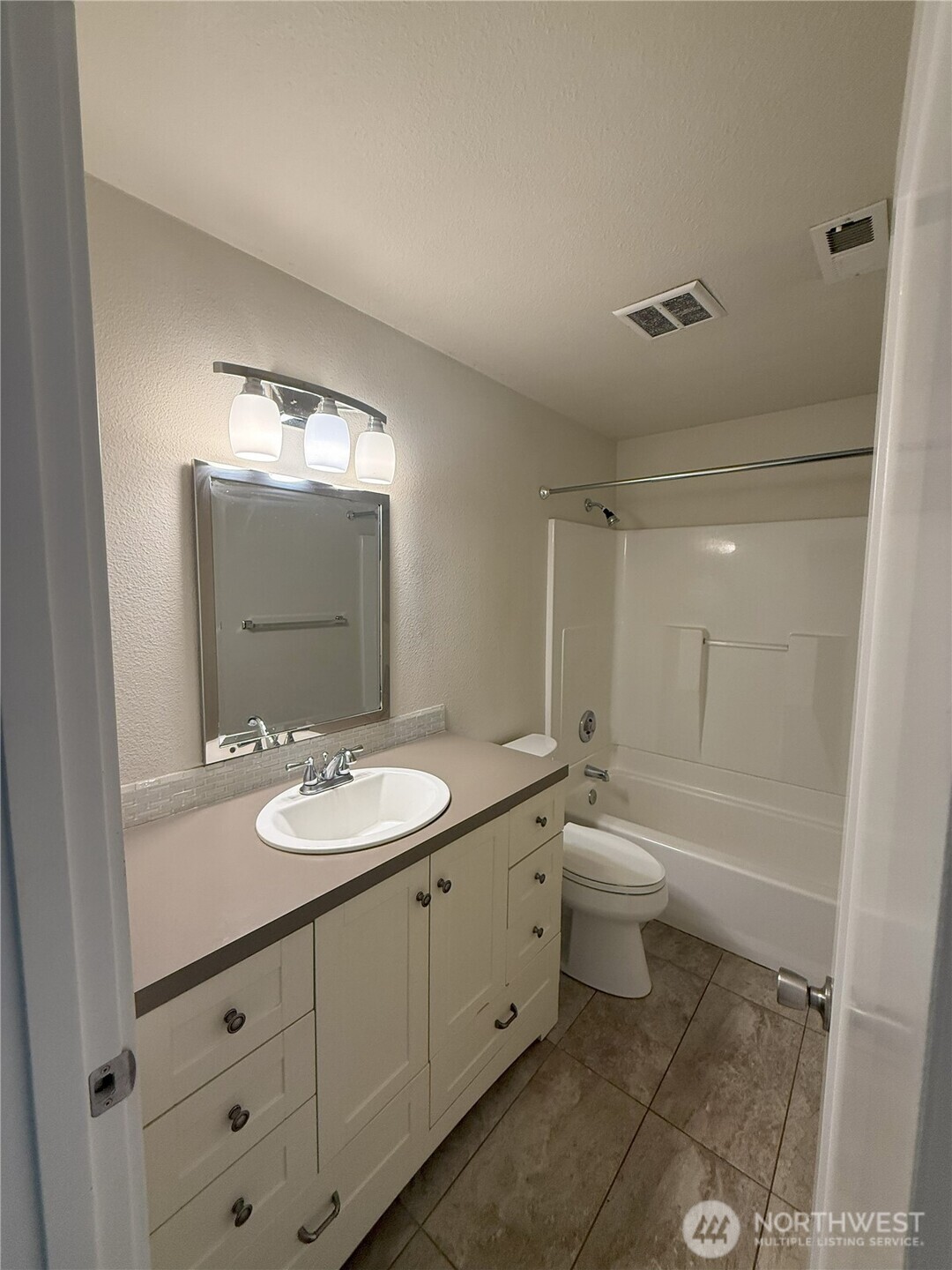 8820 Prentice Avenue Gig Harbor, WA 98332 - Photo 13 of 13 a bathroom with a double vanity sink toilet mirror and bathtub