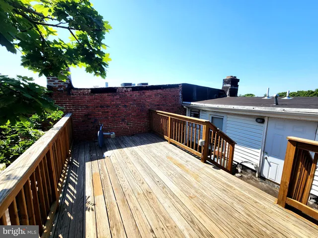 a view of balcony with furniture