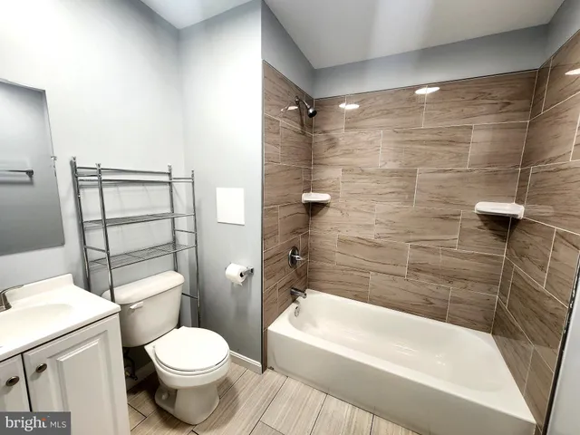 a bathroom with a toilet and shower