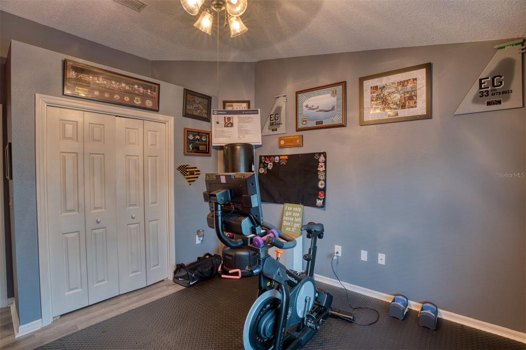 4303 Orange Ridge Court Valrico, FL 33596 - Photo 26 of 40 a view of a workspace with gym equipment