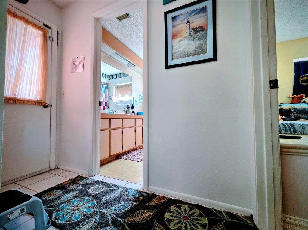 8026 Victoria Way Weeki Wachee, FL 34613 - Photo 12 of 18 a bedroom with a bed and a window