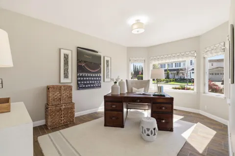 a spacious bedroom with a bed and a window