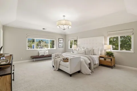 a bedroom with bed and window