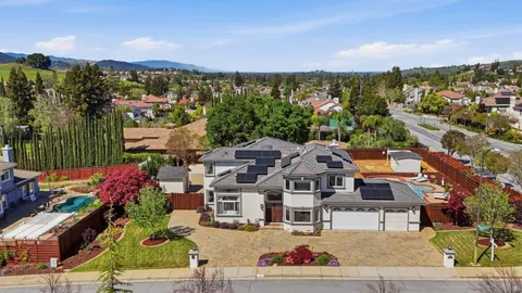 an aerial view of residential house with outdoor space