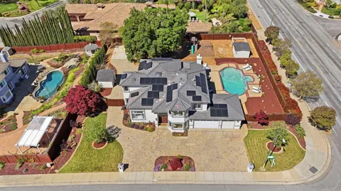 a picture of a room with a white wall and a painting