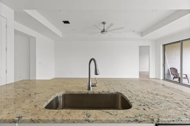 a kitchen with a sink and a window