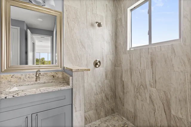 a bathroom with a sink and a mirror