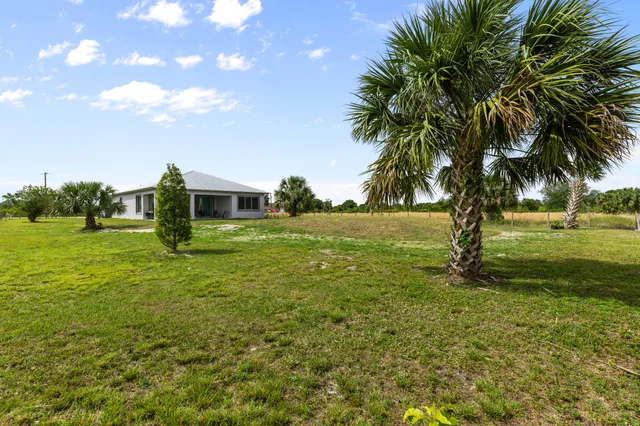 a view of a house with a big yard