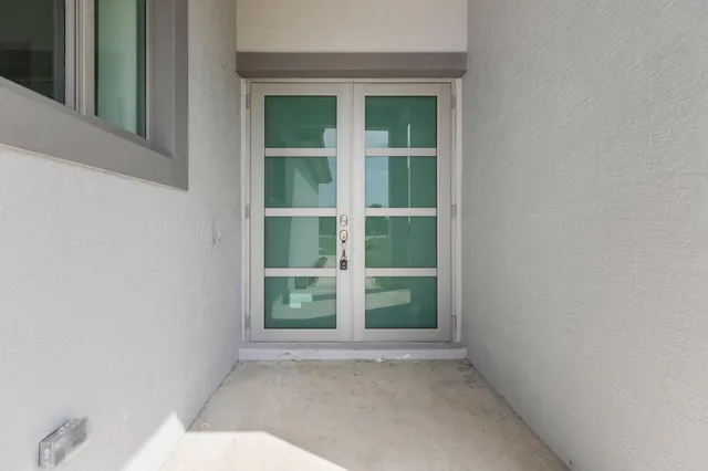 a view of empty room with windows