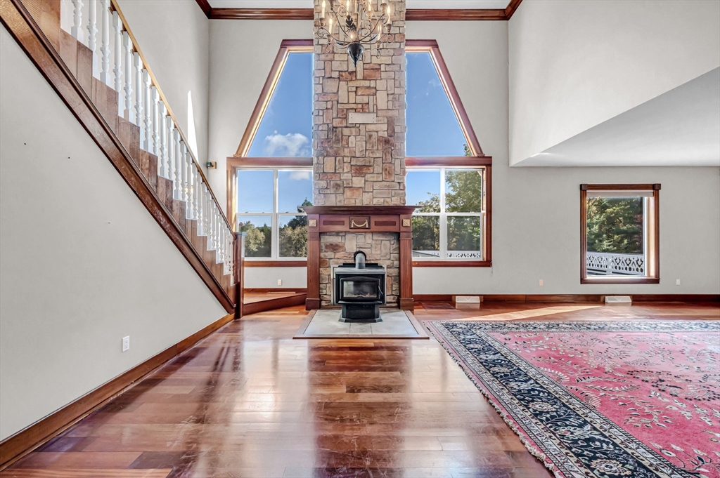 199 Chapin Road Hampden, MA 01036 - Photo 14 of 42 a living room with fireplace and wooden floor