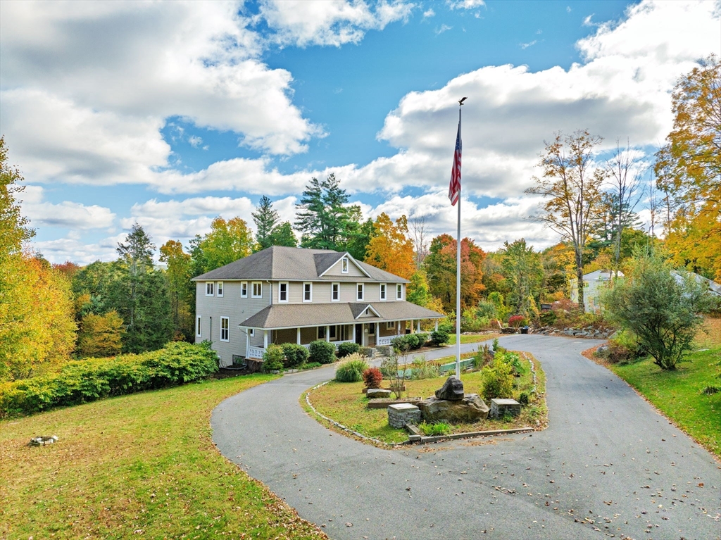 199 Chapin Road Hampden, MA 01036 - Photo 2 of 42 a front view of a house with a garden and trees