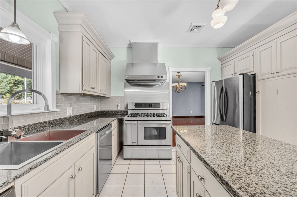 199 Chapin Road Hampden, MA 01036 - Photo 21 of 42 a kitchen with stainless steel appliances granite countertop a sink stove and refrigerator