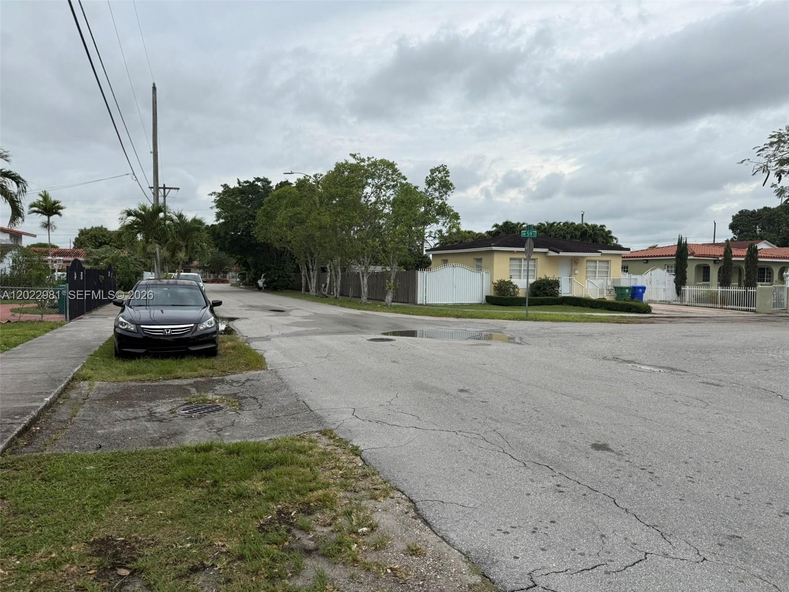 5940 Southwest 2nd Street Miami, FL 33144 - Photo 2 of 22 a car parked on the side of the road