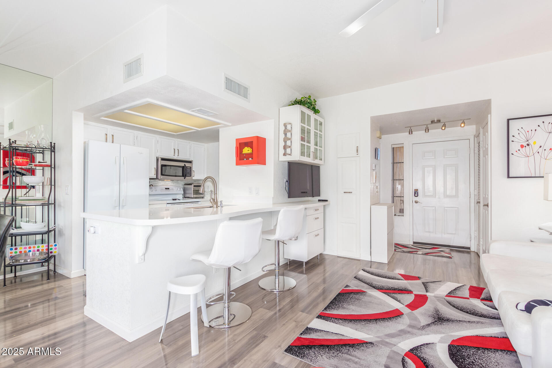 9711 East Mountain View Road, Unit 2524 Scottsdale, AZ 85258 - Photo 15 of 48 a room with furniture and a wooden floor