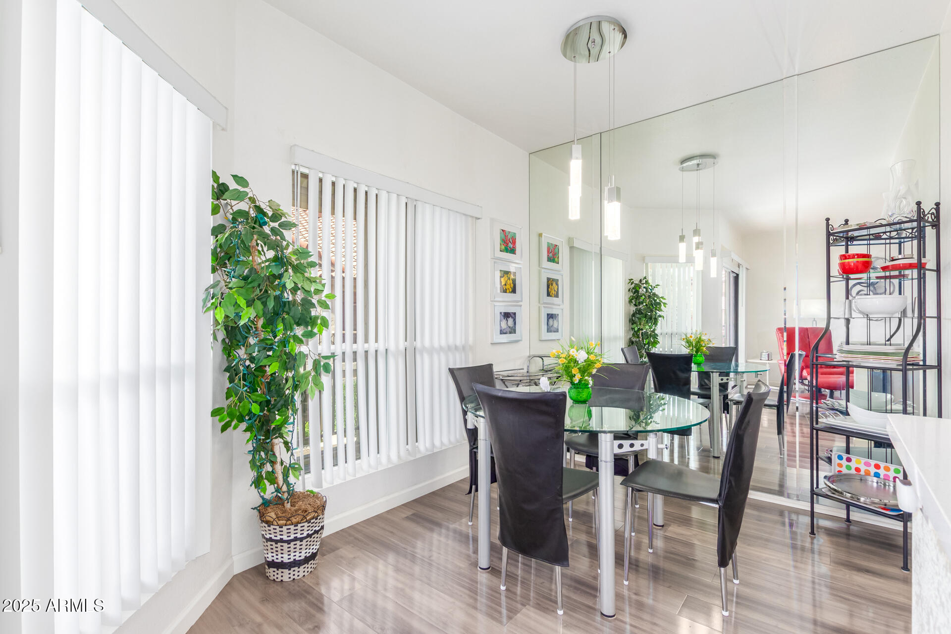 9711 East Mountain View Road, Unit 2524 Scottsdale, AZ 85258 - Photo 16 of 48 a view of a dining room with furniture and a potted plant