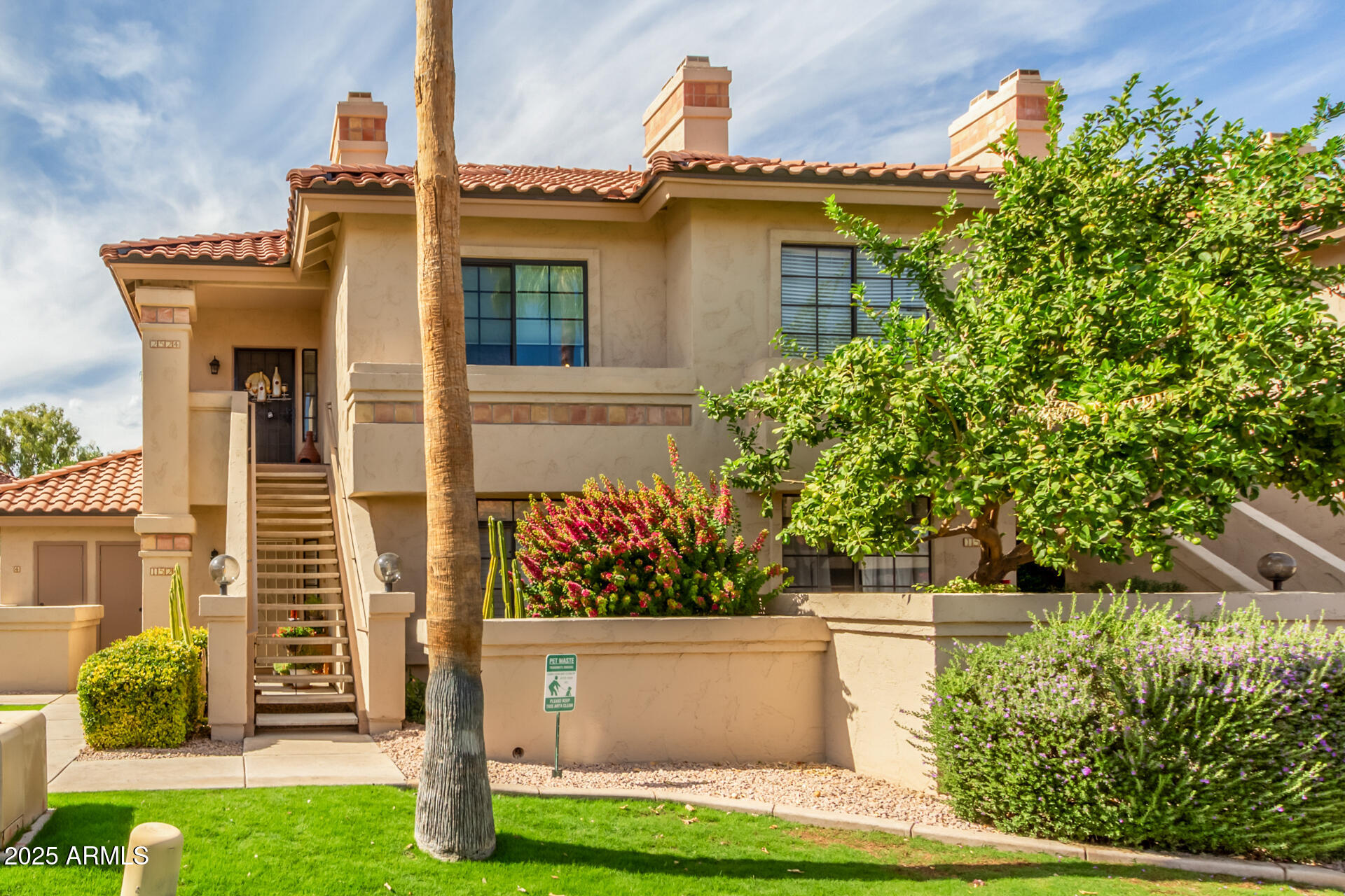 9711 East Mountain View Road, Unit 2524 Scottsdale, AZ 85258 - Photo 2 of 48 front view of a house with a yard