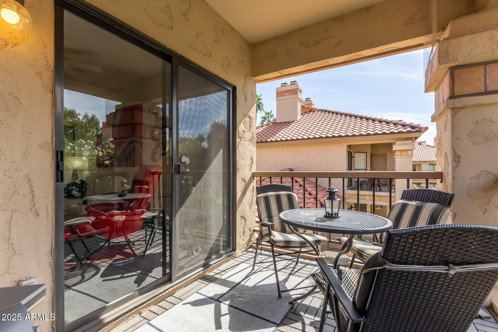 9711 East Mountain View Road, Unit 2524 Scottsdale, AZ 85258 - Photo 31 of 48 a balcony with table and chairs