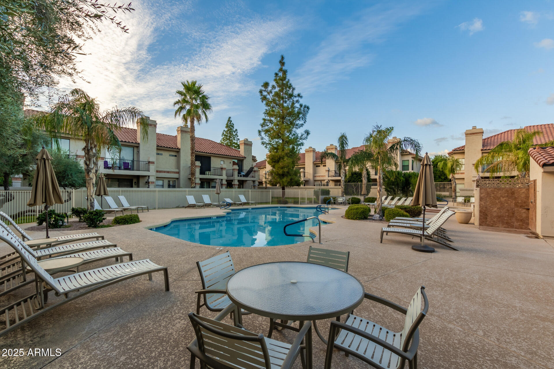 9711 East Mountain View Road, Unit 2524 Scottsdale, AZ 85258 - Photo 38 of 48 a view of a patio with swimming pool