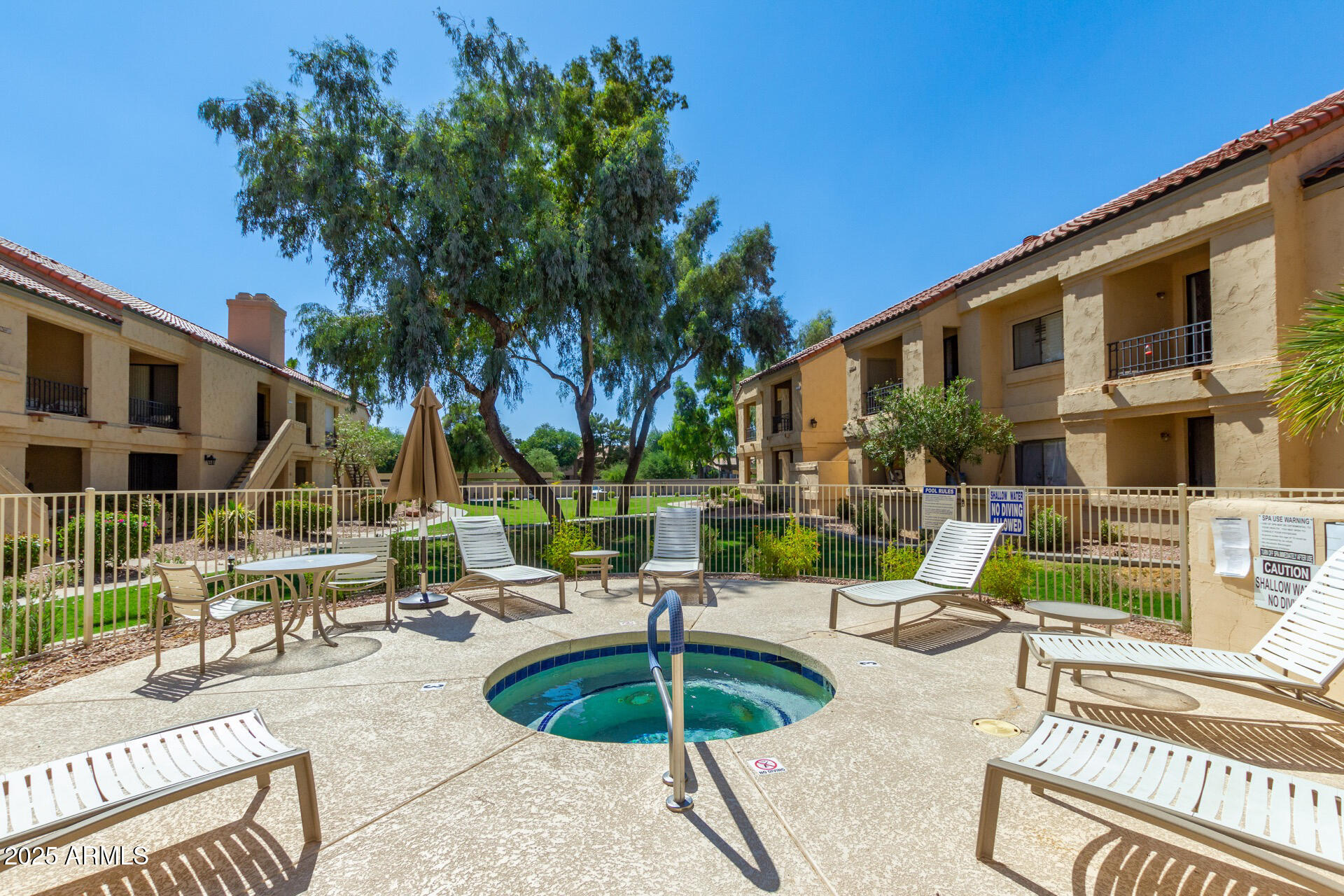 9711 East Mountain View Road, Unit 2524 Scottsdale, AZ 85258 - Photo 39 of 48 a view of a patio with swimming pool