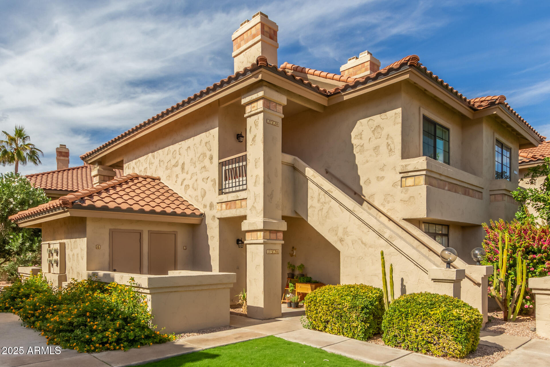 9711 East Mountain View Road, Unit 2524 Scottsdale, AZ 85258 - Photo 4 of 48 a front view of a house with garden