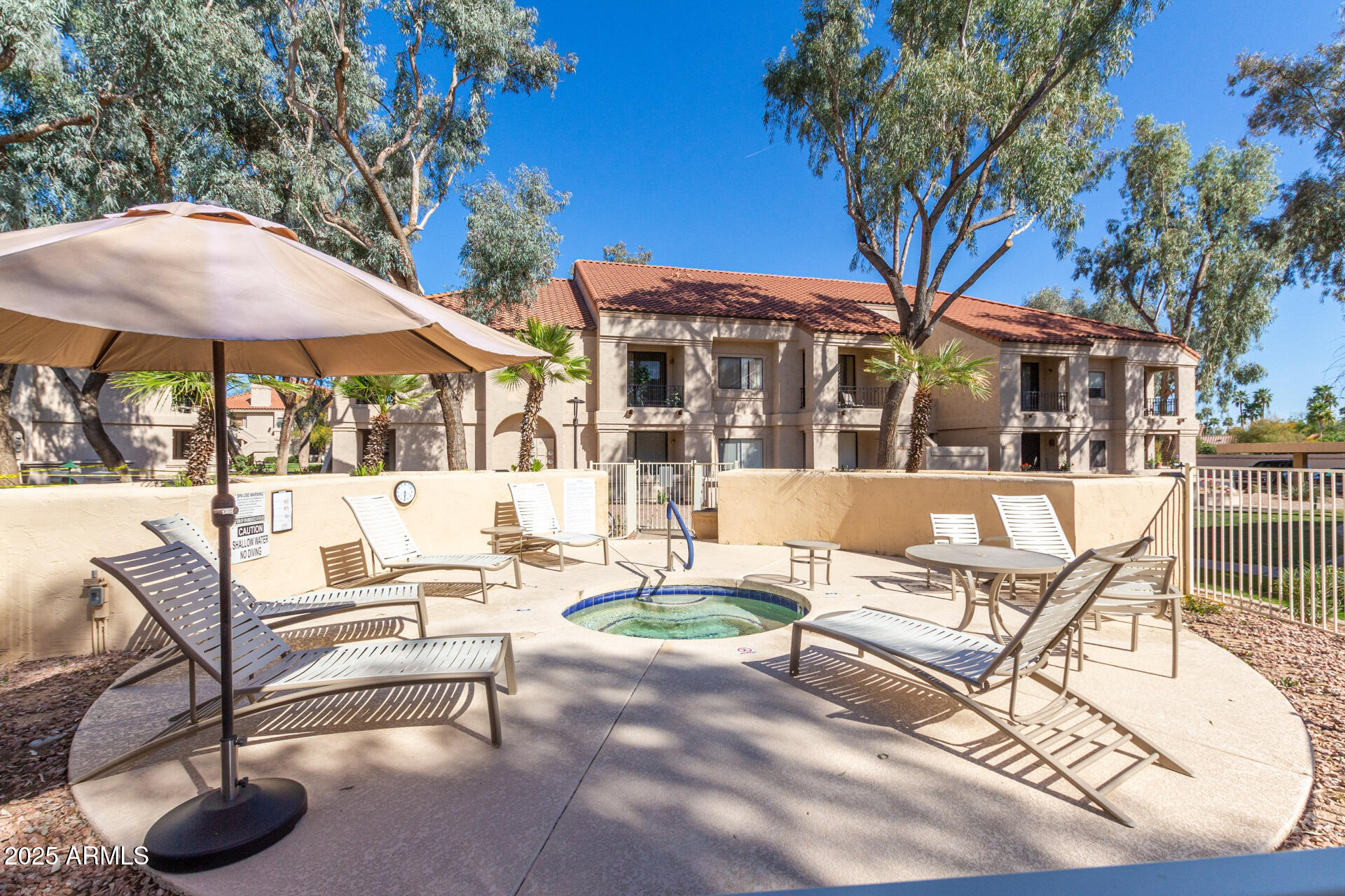 9711 East Mountain View Road, Unit 2524 Scottsdale, AZ 85258 - Photo 46 of 48 a building outdoor space with patio furniture