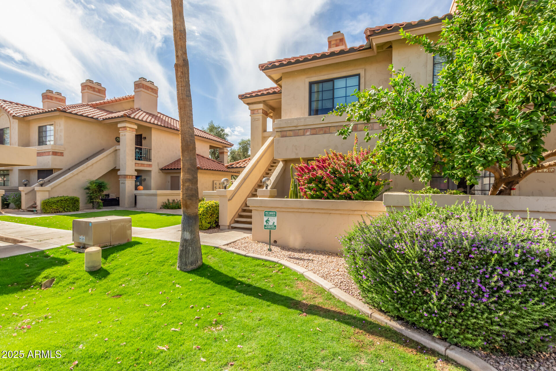 9711 East Mountain View Road, Unit 2524 Scottsdale, AZ 85258 - Photo 5 of 48 a view of a house with a yard and sitting area