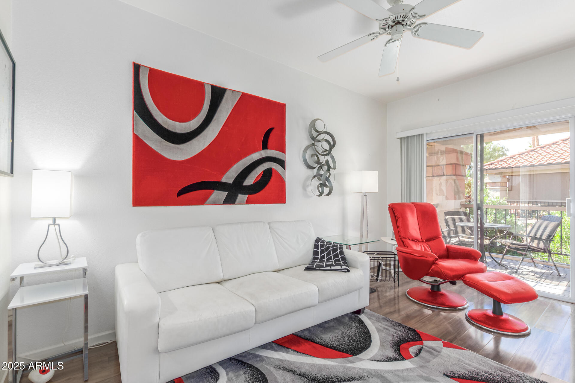 9711 East Mountain View Road, Unit 2524 Scottsdale, AZ 85258 - Photo 10 of 48 a living room with furniture and wooden floor