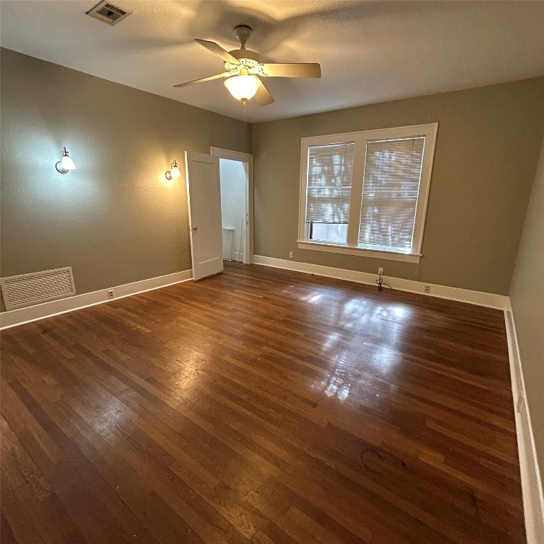 1115 West 22 1/2 Street Austin, TX 78705 - Photo 21 of 33 an empty room with wooden floor and windows
